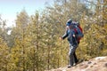 Young man hiking in forest mountains Royalty Free Stock Photo