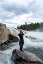 Young Man hiking outdoor Lifestyle Travel survival concept river and rocky mountains on background