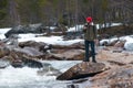 Young Man hiking outdoor Lifestyle Travel survival concept river and rocky mountains on background