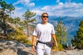 Young man hiking in the Yosemite National park. Exploring the valley Royalty Free Stock Photo