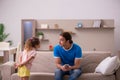 Young man with his daughter at home Royalty Free Stock Photo