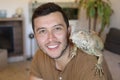 Young man and his gorgeous green iguana pet Royalty Free Stock Photo