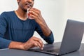 Young Man Working on Laptop with a Glass of Red Wine Royalty Free Stock Photo