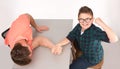 Young man and his son arm wrestling Royalty Free Stock Photo