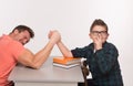 Young man and his son arm wrestling Royalty Free Stock Photo