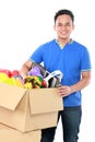 Young man with his stuff inside the box Royalty Free Stock Photo