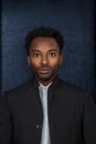 Young man in his twenties headshot on black background vertical studio portrait Royalty Free Stock Photo