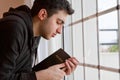 Man Praying by Window Royalty Free Stock Photo