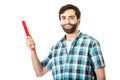 Young man holding big red pencil. Royalty Free Stock Photo