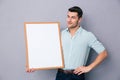 Young man holding blank board Royalty Free Stock Photo