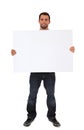 Young man holding blank white sign Royalty Free Stock Photo