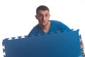 Young Man Holding Blue Mat Puzzle Royalty Free Stock Photo