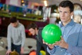 Young man holding bowling ball Royalty Free Stock Photo