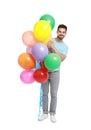 Young man holding bunch of colorful balloons on background Royalty Free Stock Photo