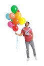 Young man holding bunch of colorful balloons Royalty Free Stock Photo