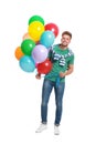 Young man holding bunch of colorful balloons Royalty Free Stock Photo