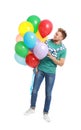 Young man holding bunch of colorful balloons Royalty Free Stock Photo