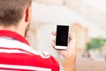 Young man holding cellphone Royalty Free Stock Photo