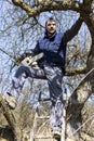 Young man holding a chainsaw trimming the tree Royalty Free Stock Photo