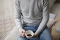 Young man holding cup of coffee inside the coffee shop Royalty Free Stock Photo