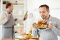 Young man with roast turkey