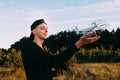 Young man holding drone before flight at nature Royalty Free Stock Photo
