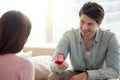 Young man holding engagement ring, making marriage proposal to g Royalty Free Stock Photo