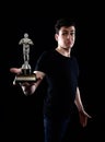 Young man holding fake oscar award