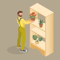 A young man is holding a flowerpot. Isometric vector illustration.