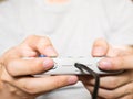 A young man holding game controller playing video games Royalty Free Stock Photo