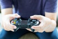 Young man holding game controller playing video games, Selected focus fingers Royalty Free Stock Photo