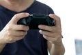 Young man holding game controller playing video games, Selected focus fingers Royalty Free Stock Photo