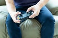 Young man holding game controller playing video games, Selected focus fingers Royalty Free Stock Photo