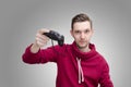 Young man holding game controller