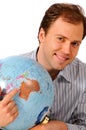 Young man holding a globe