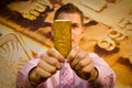 Young businessman holding a gold bar Royalty Free Stock Photo