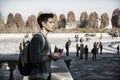 Young Man Holding a Guide Outside Historic Building Royalty Free Stock Photo