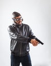 Young man holding a gun with both hands Royalty Free Stock Photo