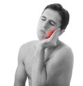 Young man holding his aching tooth in pain, Royalty Free Stock Photo