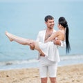 Young man holding his girlfriend Royalty Free Stock Photo