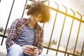 Young man holding and looking mobile phone Royalty Free Stock Photo