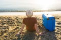 Young man holding luggage at the sea. Travel, summertime, holidays and people concept. Royalty Free Stock Photo