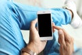 Young man holding mobile phone with blank screen Royalty Free Stock Photo