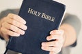 Young man holding out his Bible Royalty Free Stock Photo