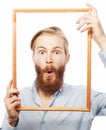 Young man holding picture frame Royalty Free Stock Photo