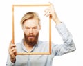 Young man holding picture frame Royalty Free Stock Photo