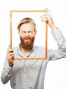 Young man holding picture frame Royalty Free Stock Photo