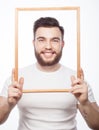 Young man holding picture frame Royalty Free Stock Photo