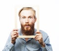 Young man holding picture frame Royalty Free Stock Photo