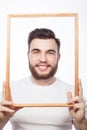 Young man holding picture frame Royalty Free Stock Photo